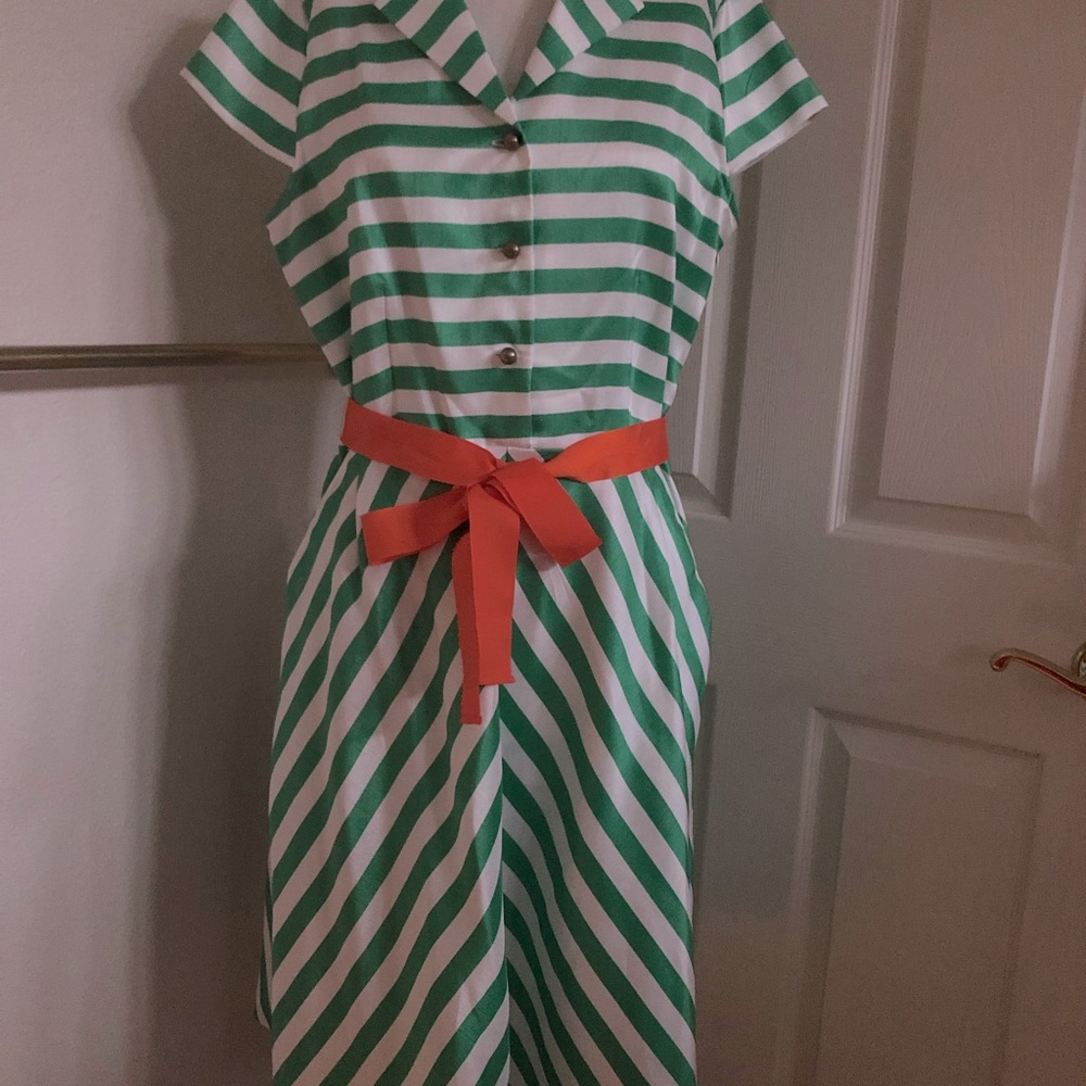 Green striped dress with orange tie belt.